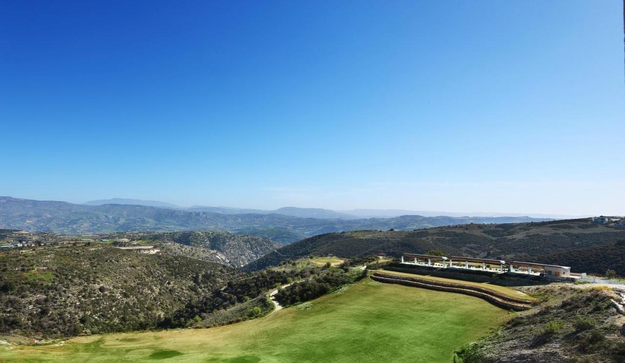 Minthis Resort Tsadha Esterno foto View of the golf course