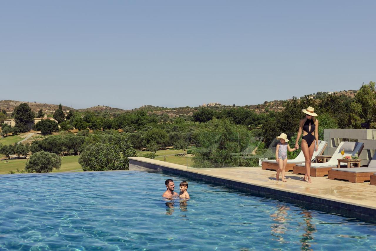 Minthis Resort Tsadha Esterno foto The pool at the hotel