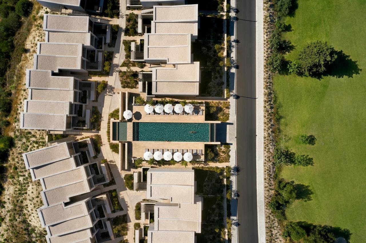 Minthis Resort Tsadha Esterno foto Aerial view of the hotel