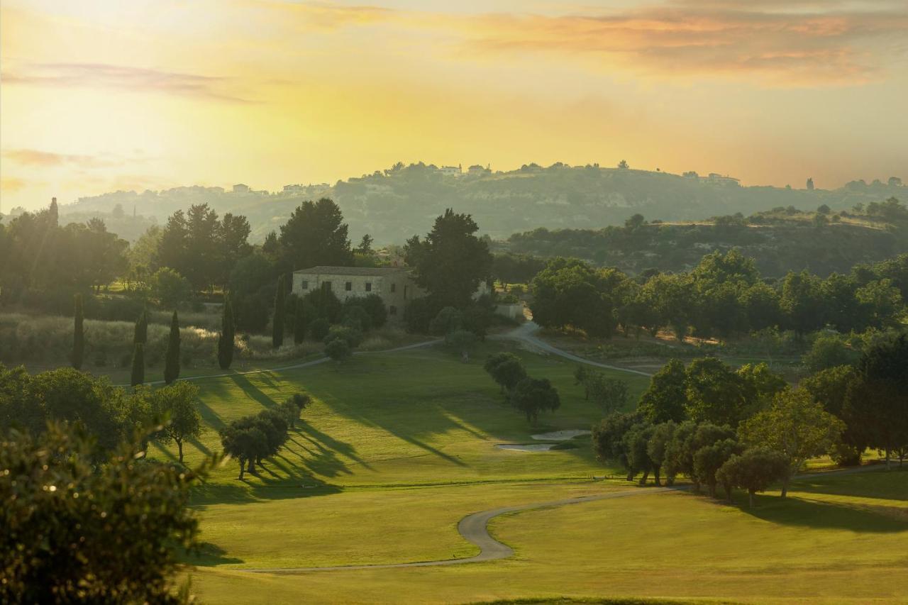Minthis Resort Tsadha Esterno foto View of the golf course